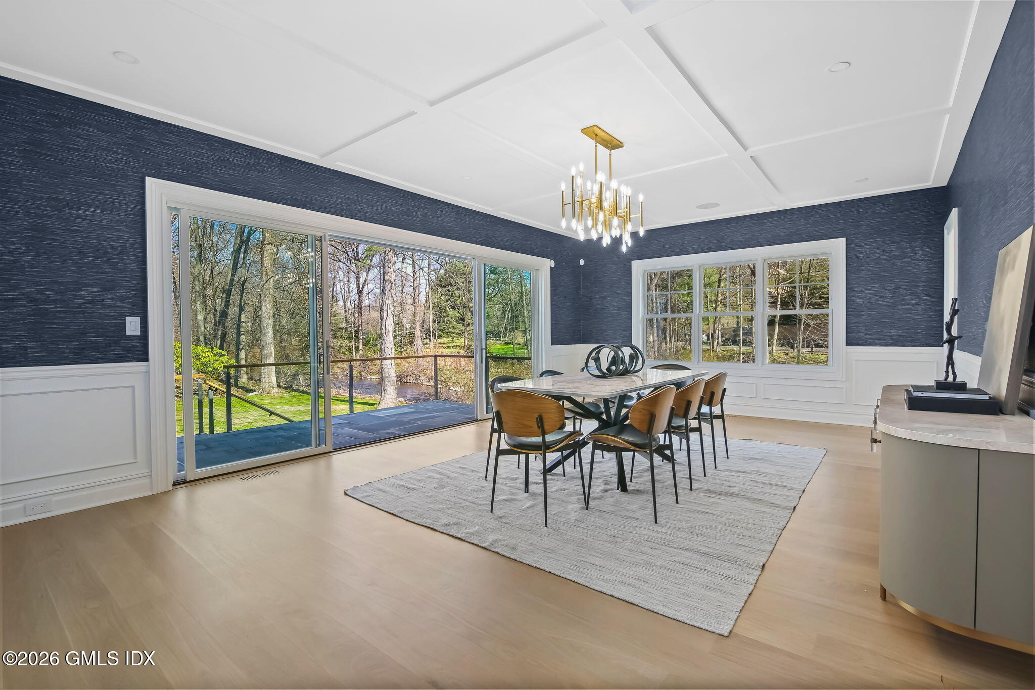 7 Bailiwick Road Greenwich, CT 06831 - Photo 6 of 42 a dining room with furniture a chandelier and wooden floor