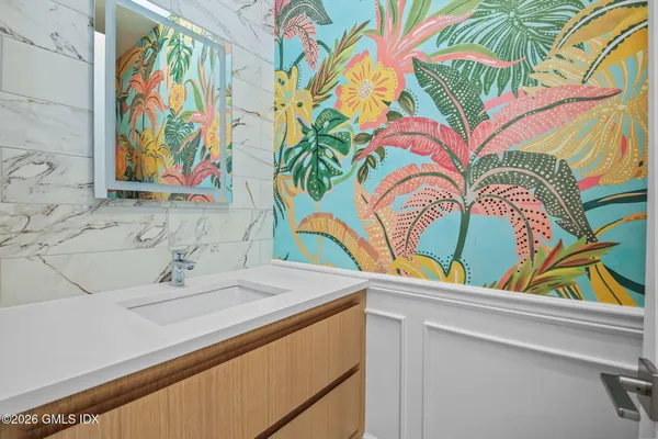 a bathroom with a sink and a mirror