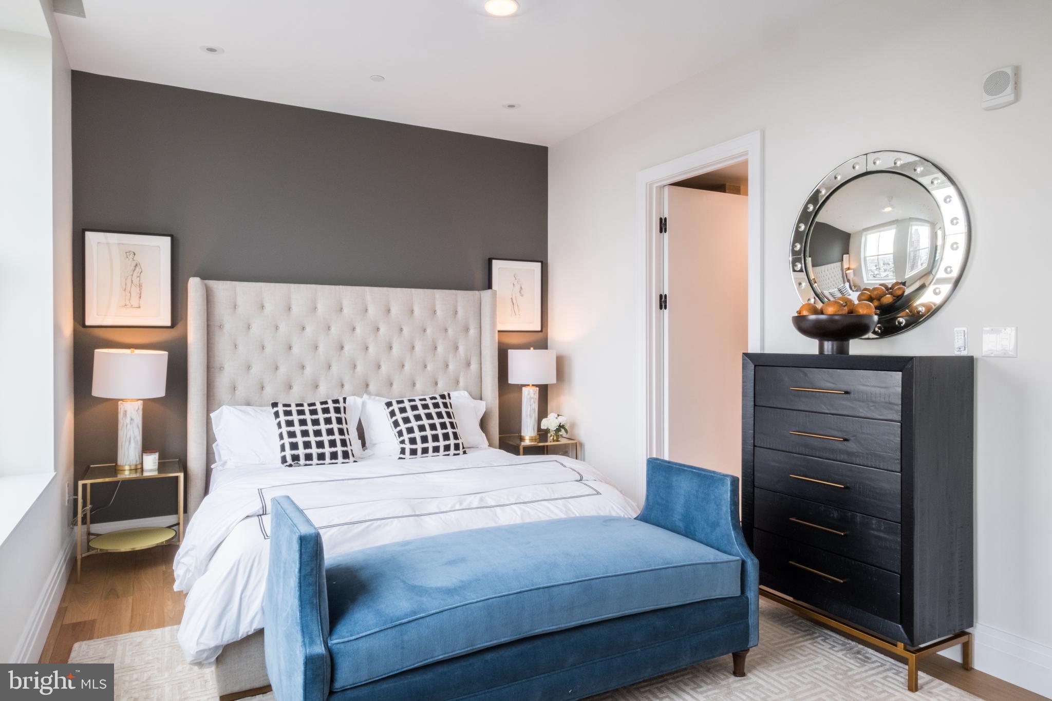 1401 Spruce Street, Unit 3BED B Philadelphia, PA 19102 - Photo 11 of 13 a bedroom with a bed and a dresser