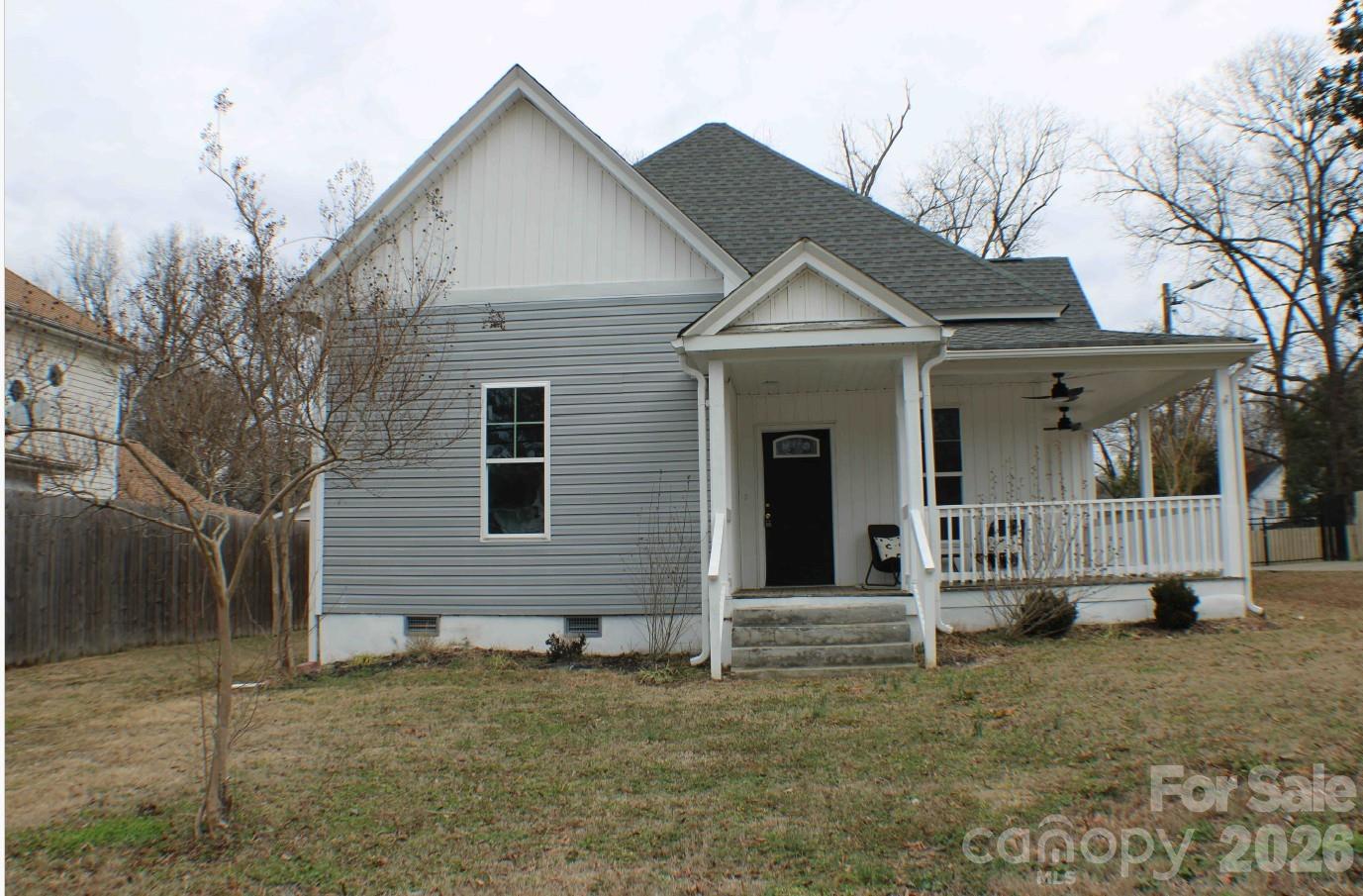 a view of a brick house with a yard