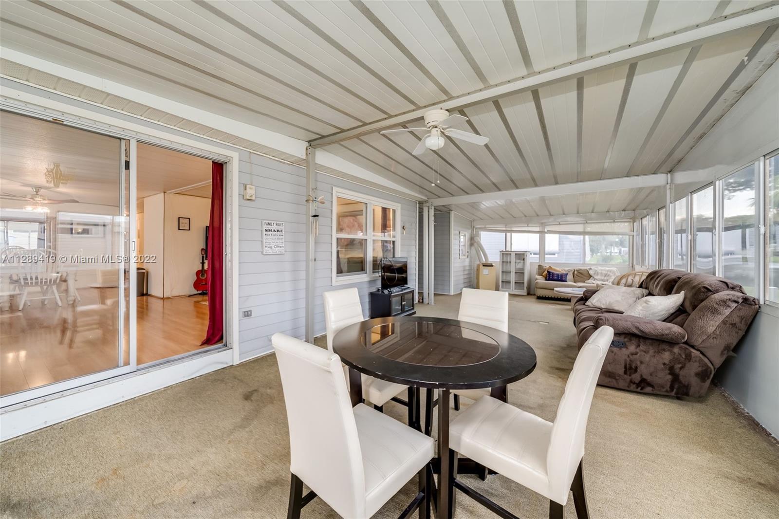 8311 South Street Boca Raton, FL 33433 - Photo 29 of 40 a view of a dining room with furniture window and outside view