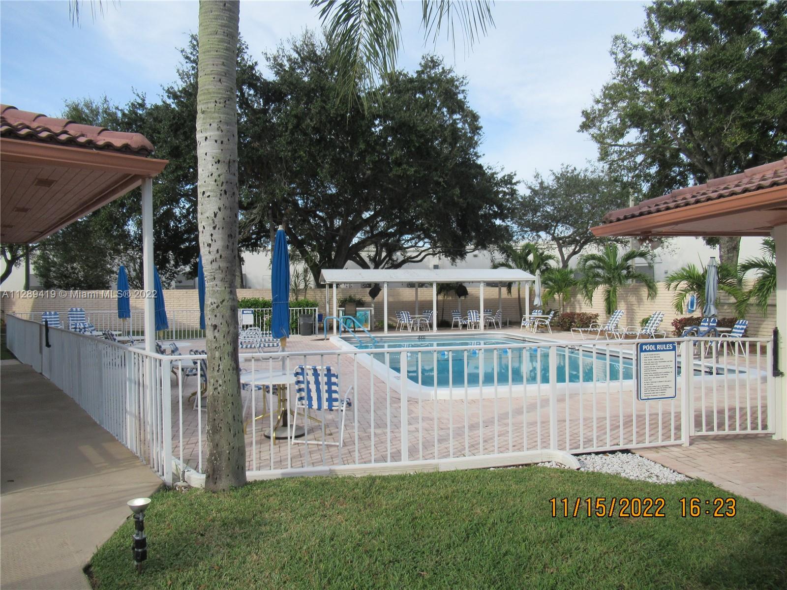 8311 South Street Boca Raton, FL 33433 - Photo 33 of 40 a front view of house with a garden