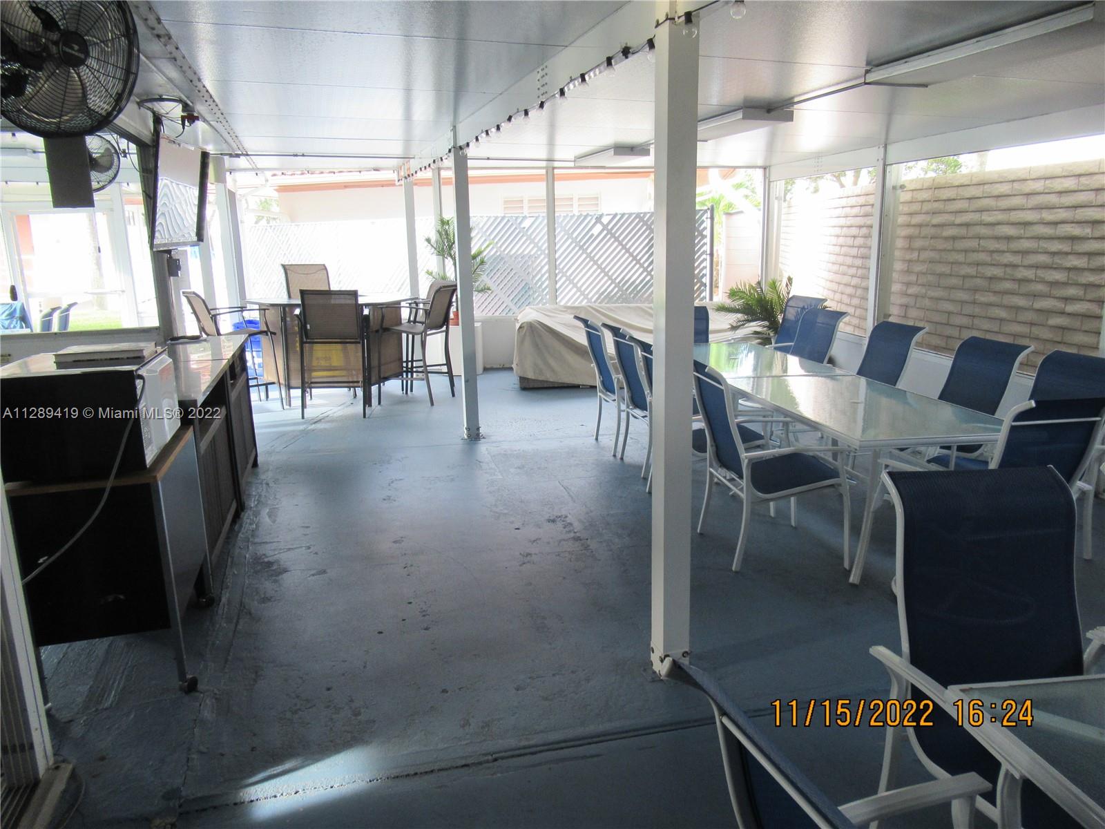 8311 South Street Boca Raton, FL 33433 - Photo 36 of 40 a view of a dining room with furniture window and outside view