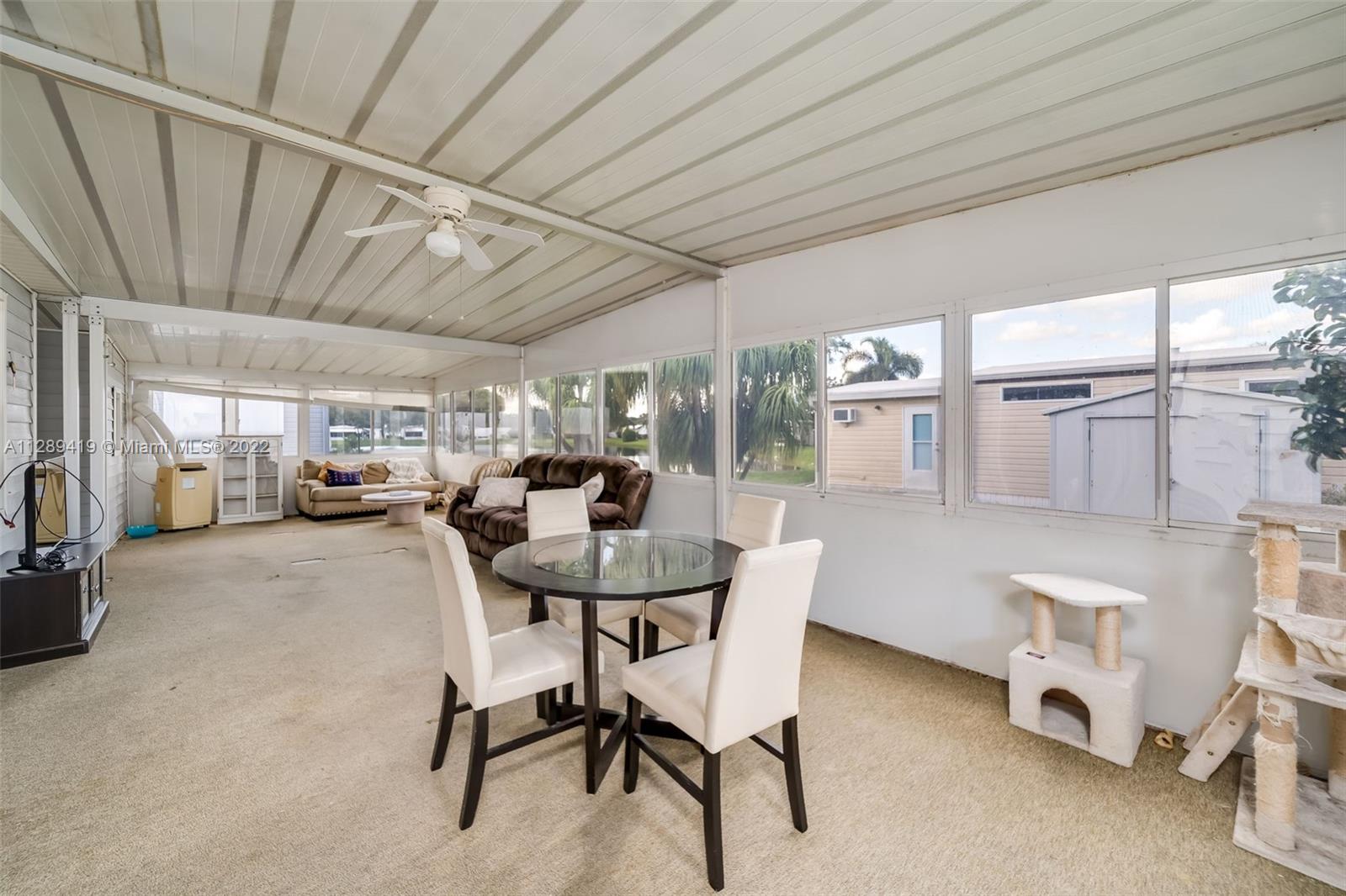 8311 South Street Boca Raton, FL 33433 - Photo 9 of 40 a dining room with furniture and a chandelier