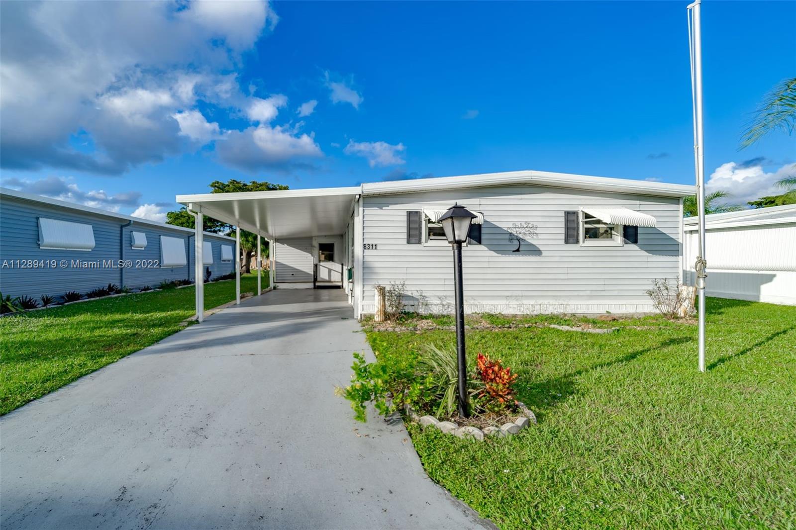 8311 South Street Boca Raton, FL 33433 - Photo 10 of 40 a view of a porch in front of house
