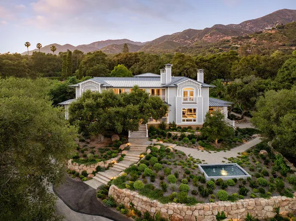 an aerial view of a house with a garden
