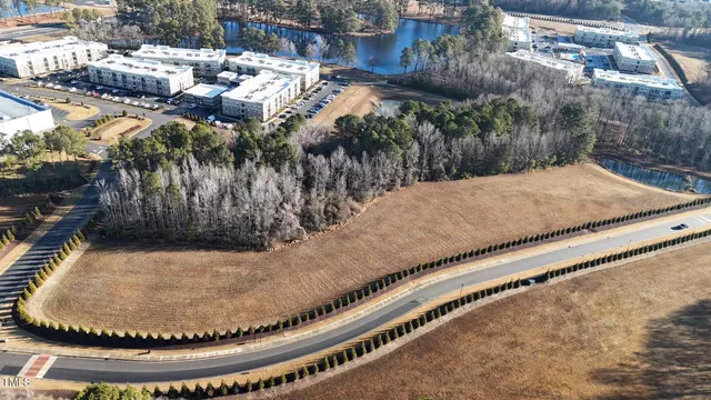 a view of a swimming pool with a yard