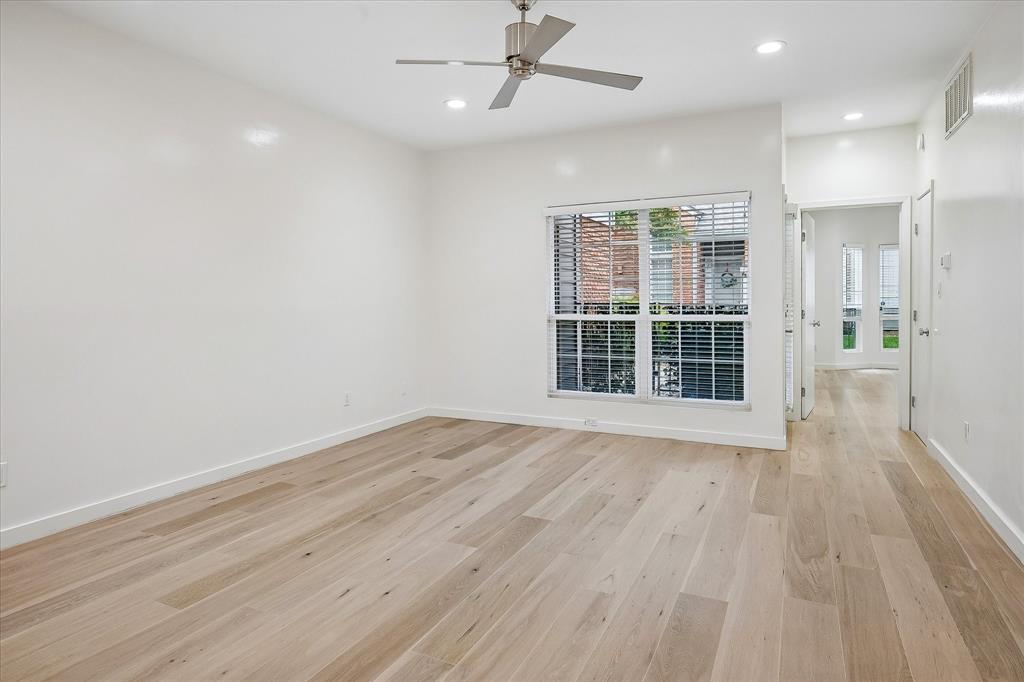 Large living area with beautiful floors.  This room overlooks the patio.