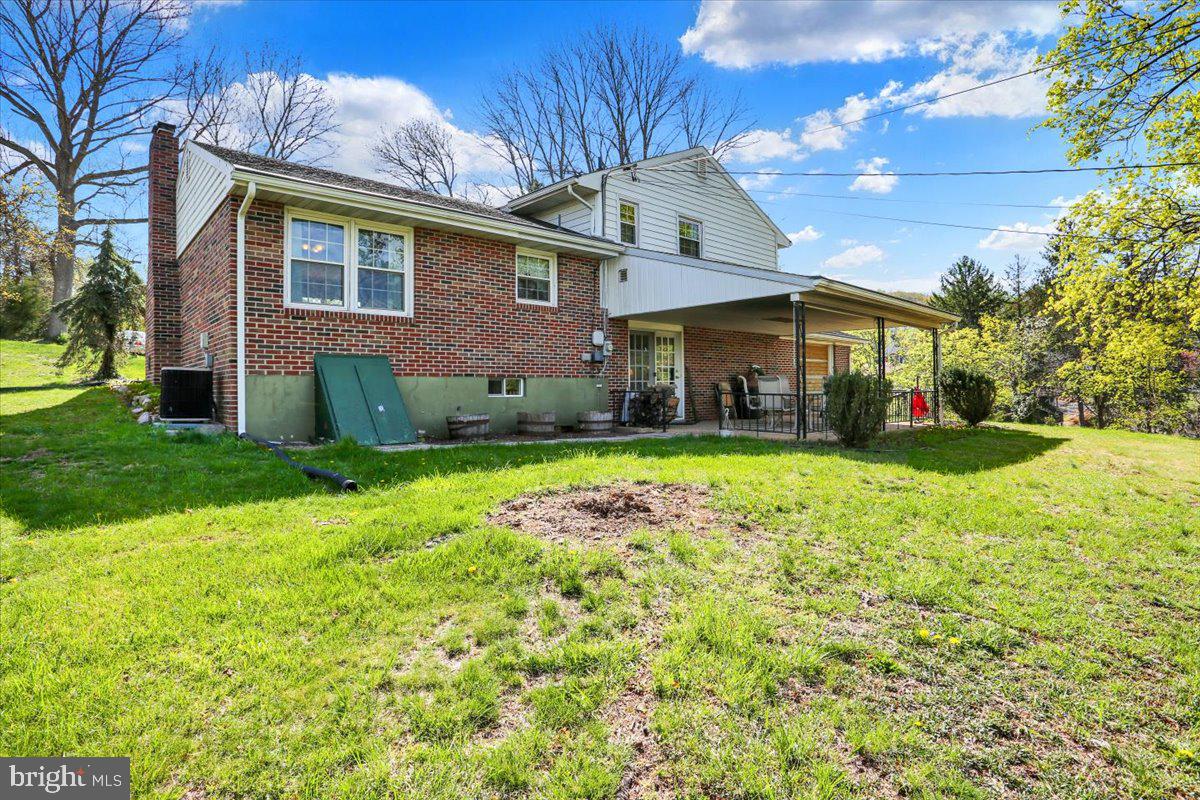 324 Ashley Drive Reading, PA 19607 - Photo 36 of 39 a front view of a house with garden