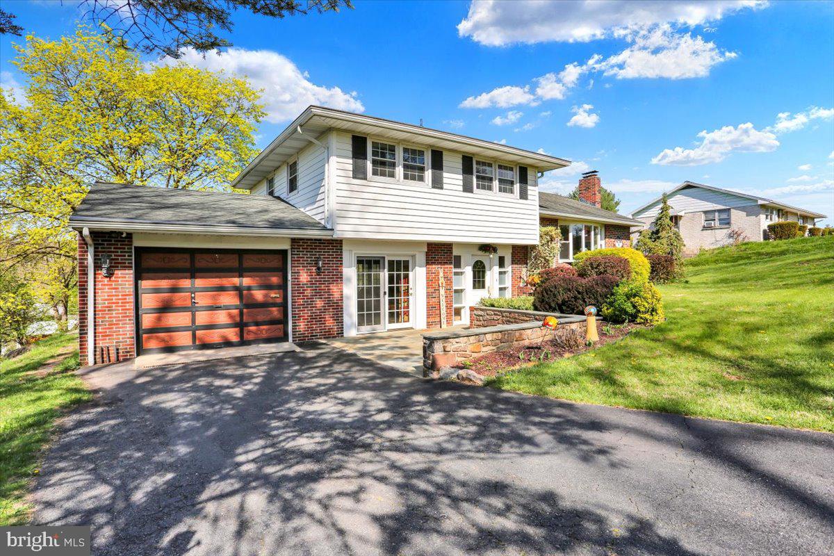 324 Ashley Drive Reading, PA 19607 - Photo 4 of 39 a front view of a house with a yard