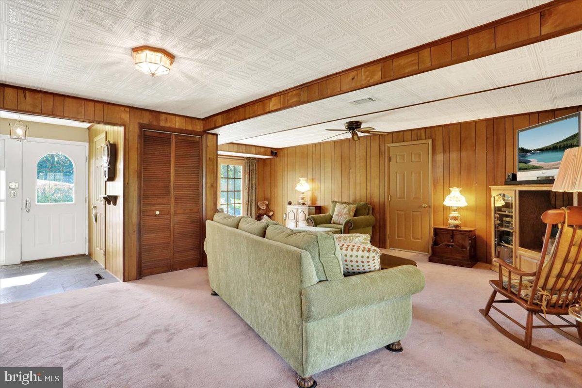324 Ashley Drive Reading, PA 19607 - Photo 10 of 39 a living room with furniture and a chandelier
