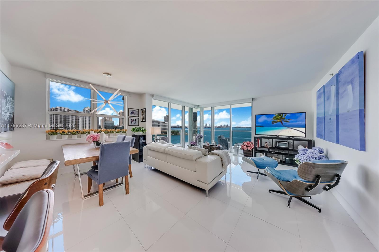 1155 Brickell Bay Drive, Unit 1210 Miami, FL 33131 - Photo 5 of 18 a living room with furniture and a couch