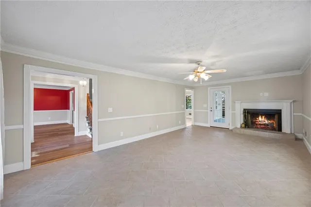 a view of wooden floor and windows in a room