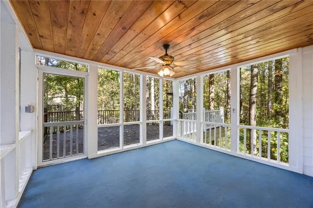 a kitchen with stainless steel appliances granite countertop lots of counter top space and wooden floor