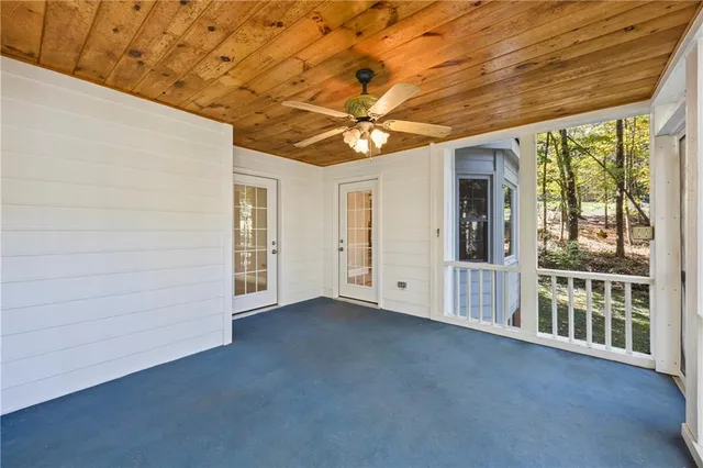 a kitchen with stainless steel appliances granite countertop a stove a sink dishwasher and a refrigerator with wooden cabinets