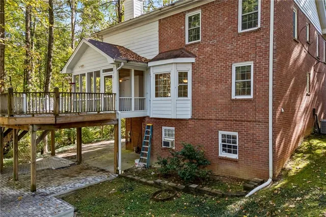 front view of a brick house with a large windows