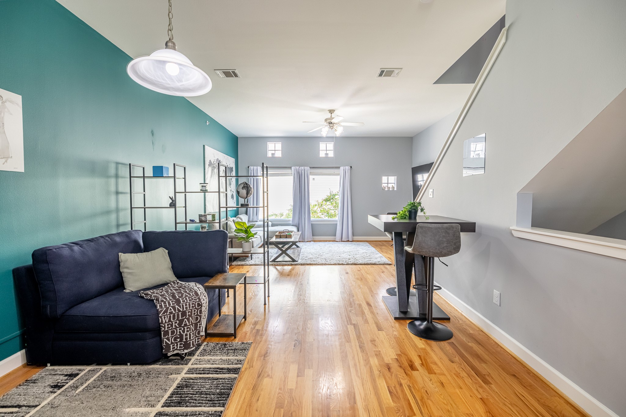 8705 Bryam Street, Unit 303 Houston, TX 77061 - Photo 11 of 14 a living room with furniture and a wooden floor