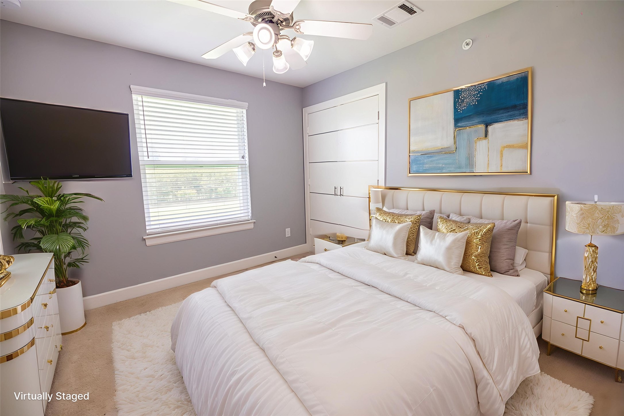 8705 Bryam Street, Unit 303 Houston, TX 77061 - Photo 6 of 14 a bedroom with a large bed and a flat tv screen