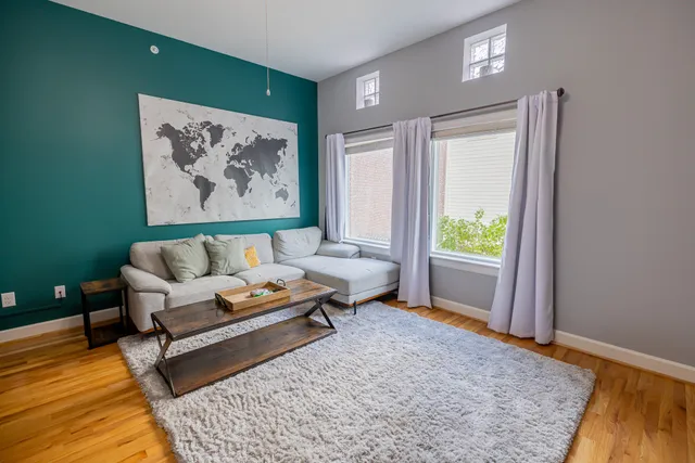 a living room with furniture and a rug