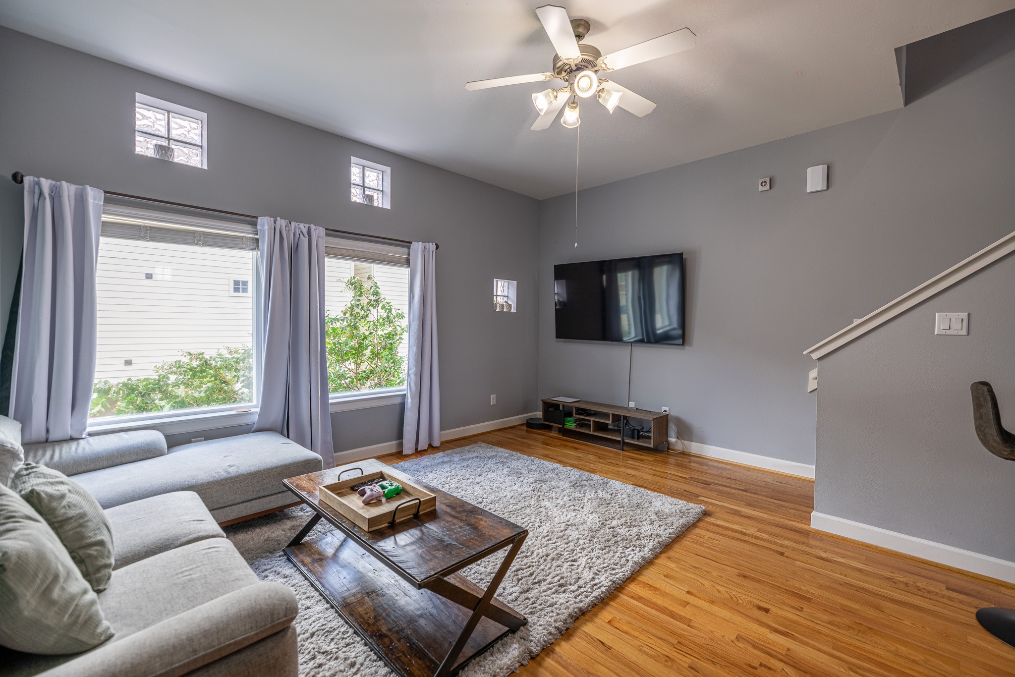 8705 Bryam Street, Unit 303 Houston, TX 77061 - Photo 8 of 14 a living room with furniture and a flat screen tv