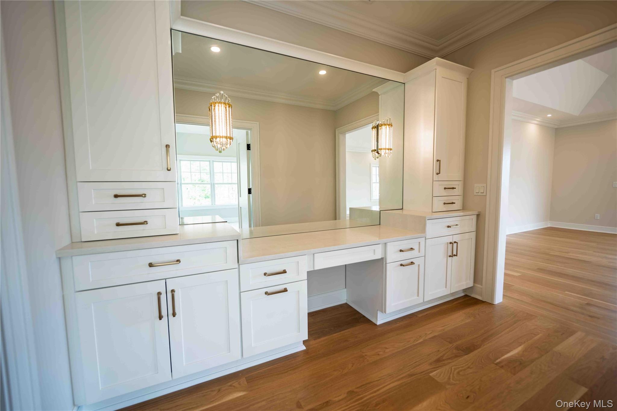 106 Cove Road Asharoken, NY 11768 - Photo 24 of 46 Bathroom featuring dark wood finished floors, vanity, crown molding, and recessed lighting