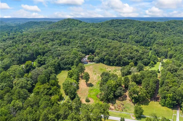 a kitchen with stainless steel appliances granite countertop a refrigerator sink and stove