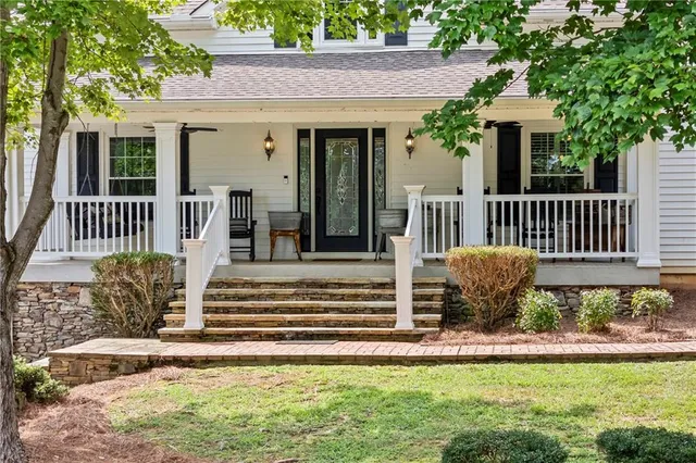 a living room with furniture fireplace and flat screen tv