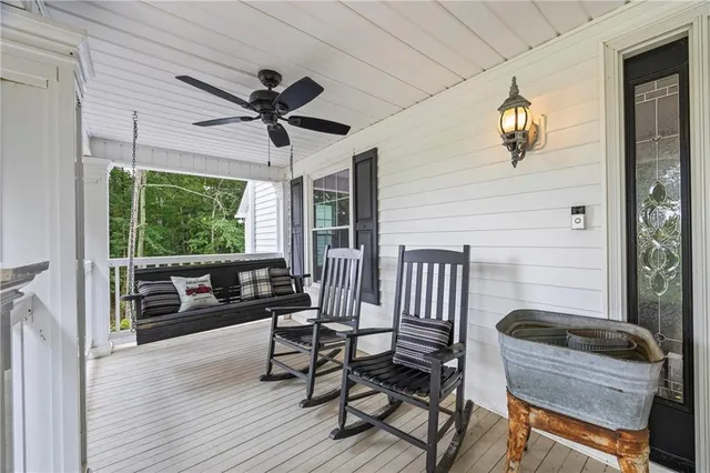 a living room with fireplace furniture and decor