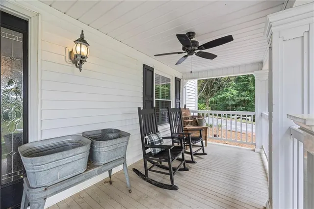 a living room with fireplace furniture and a chandelier