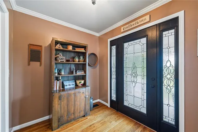 a bathroom with a glass shower door and a sink