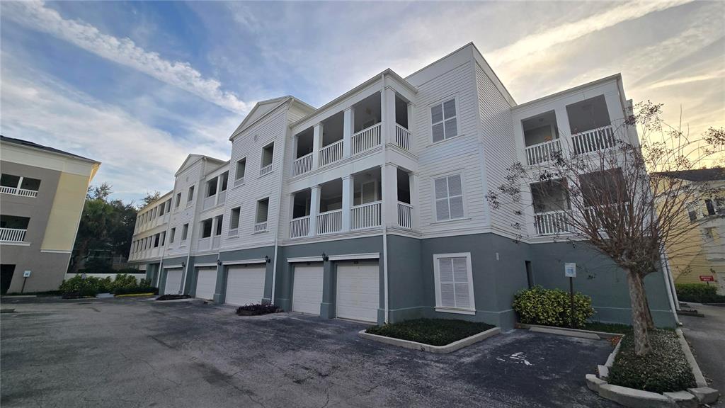791 Celebration Avenue, Unit 791 Celebration, FL 34747 - Photo 1 of 27 a large building with a lot of windows