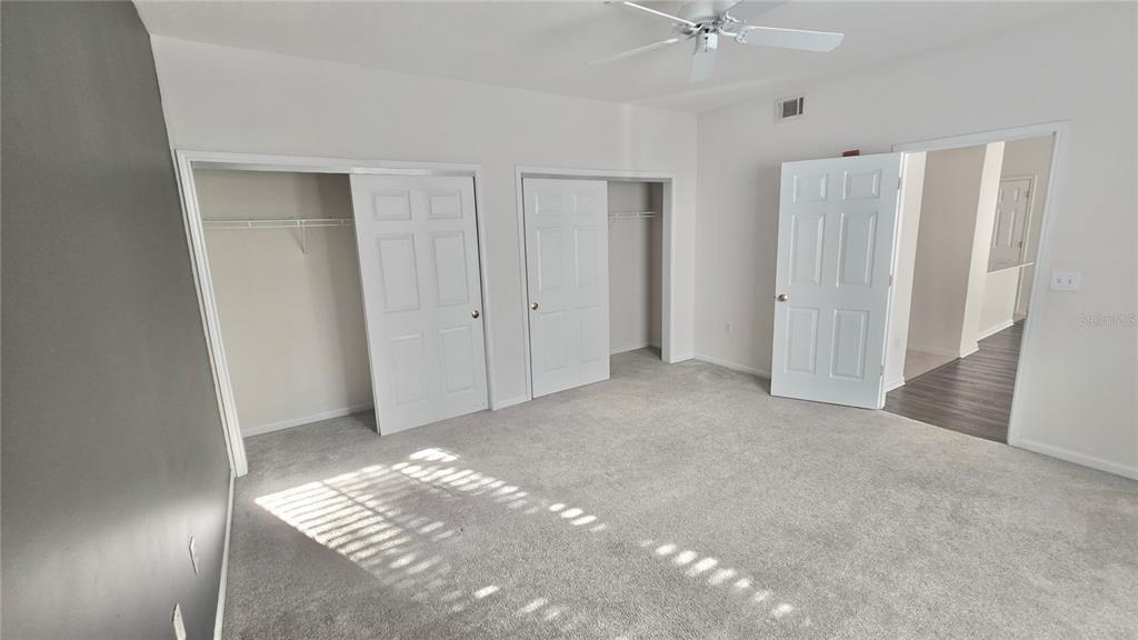 791 Celebration Avenue, Unit 791 Celebration, FL 34747 - Photo 18 of 27 a view of livingroom with window and ceiling fan