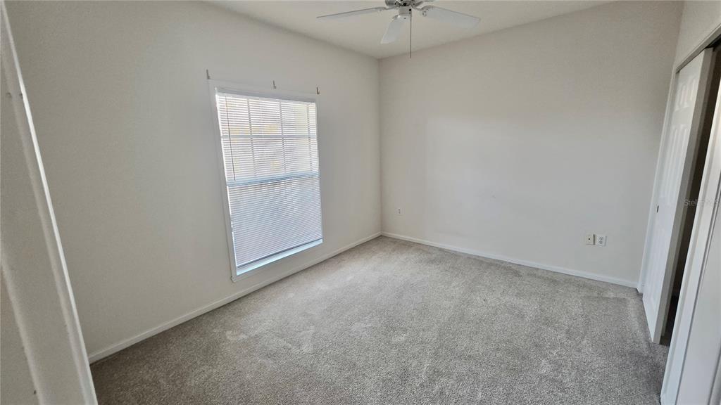791 Celebration Avenue, Unit 791 Celebration, FL 34747 - Photo 19 of 27 an empty room with a window