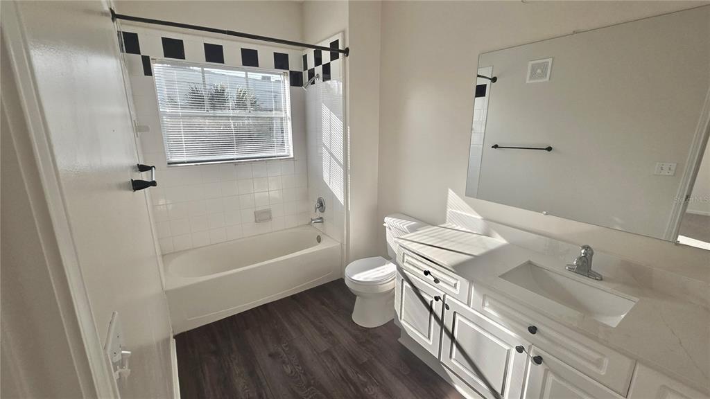 791 Celebration Avenue, Unit 791 Celebration, FL 34747 - Photo 22 of 27 a bathroom with a sink a toilet and shower