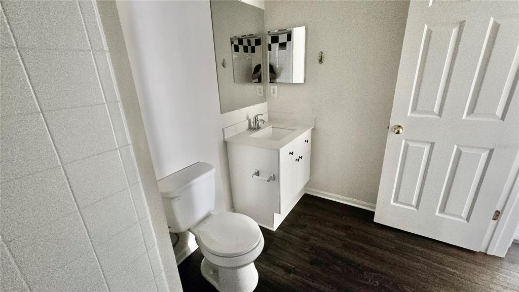 791 Celebration Avenue, Unit 791 Celebration, FL 34747 - Photo 25 of 27 a bathroom with a sink and toilet