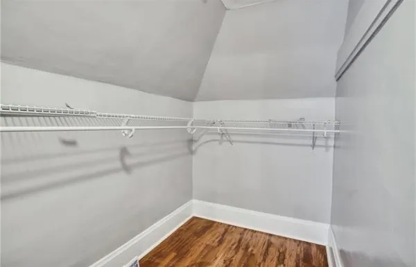 a view of garden with deck and flowers