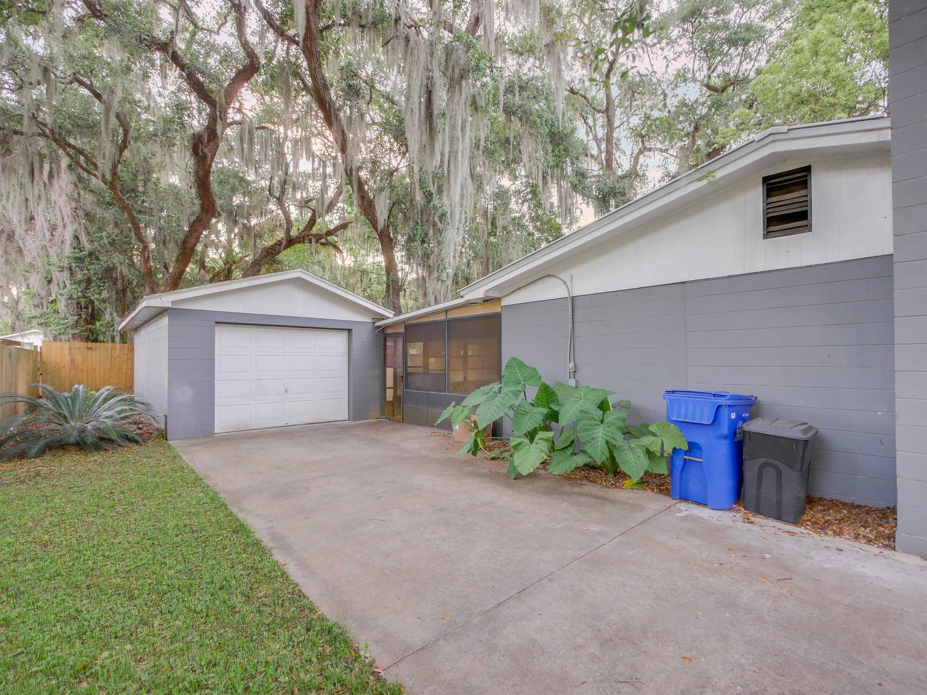 258 Mimosa Road St. Augustine, FL 32086 - Photo 28 of 32 a front view of a house with garden