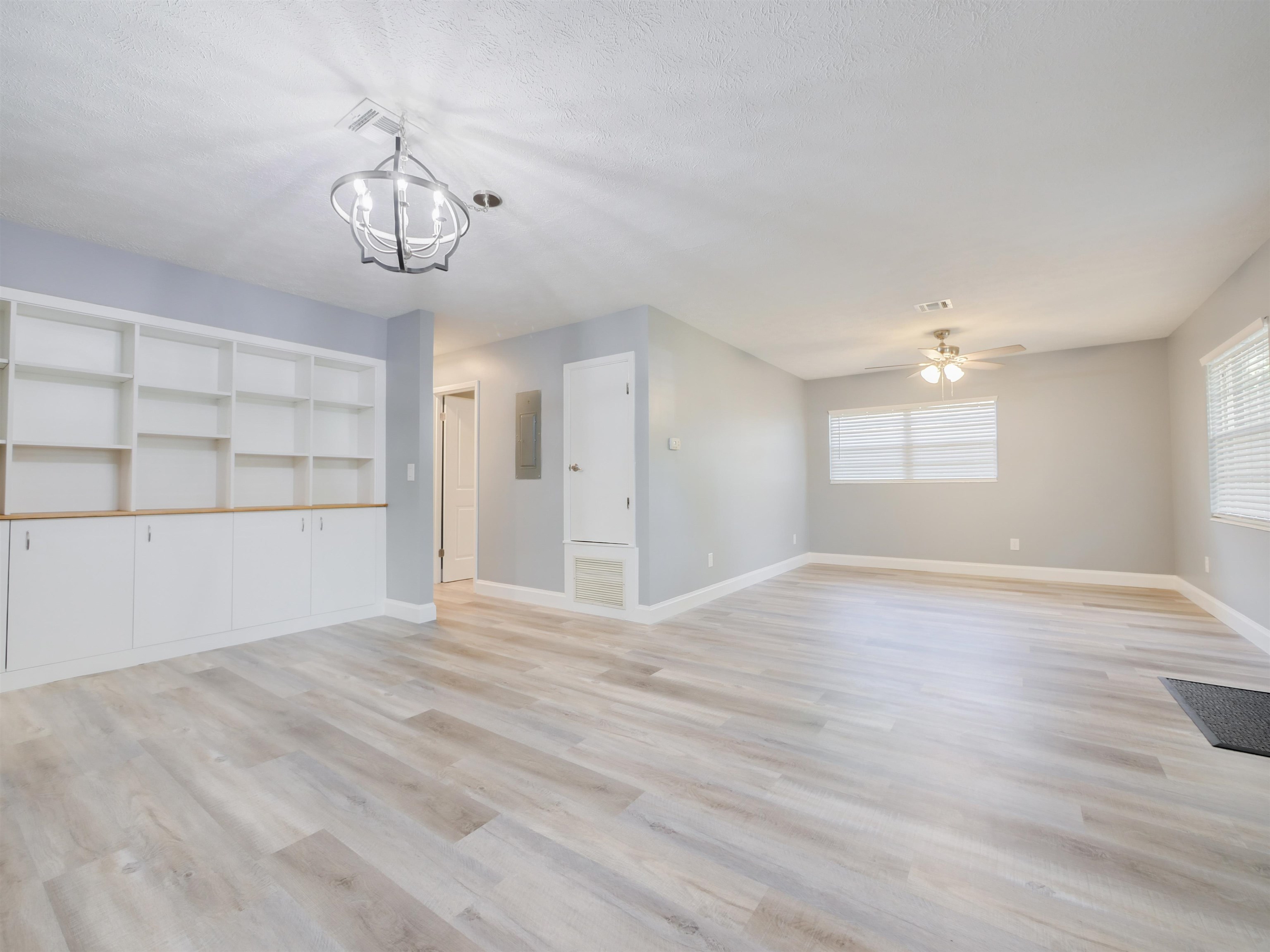 258 Mimosa Road St. Augustine, FL 32086 - Photo 4 of 32 a view of empty room with wooden floor and window
