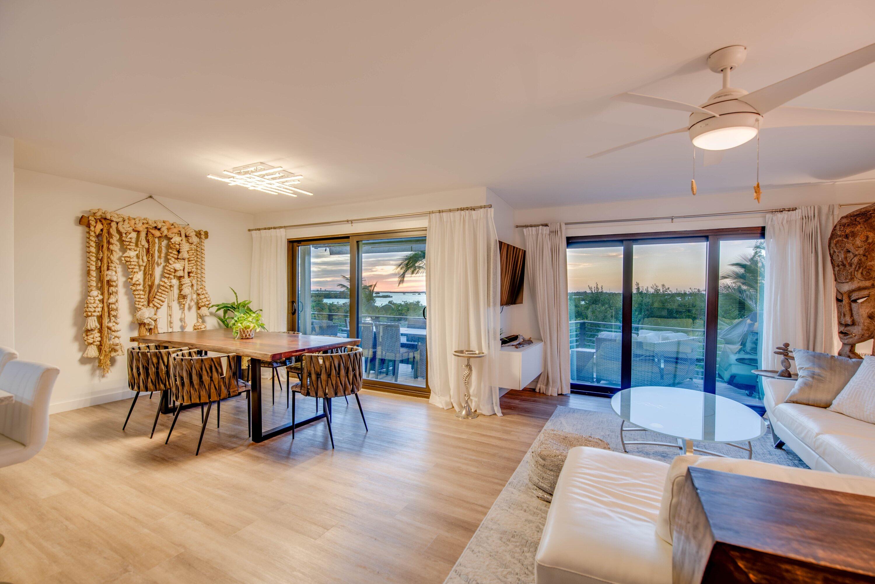 1422 Boca Chica Road Key West, FL 33040 - Photo 11 of 54 a living room with furniture a dining table and a large window