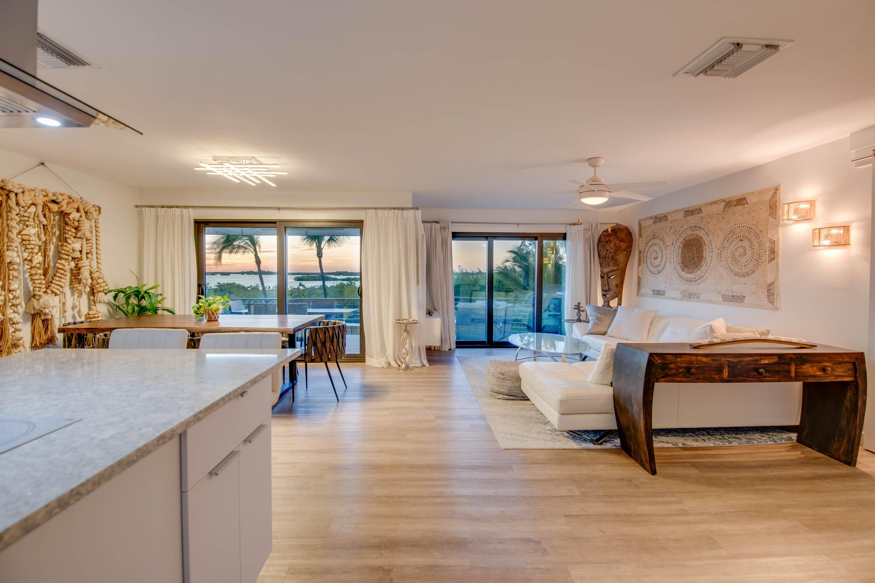1422 Boca Chica Road Key West, FL 33040 - Photo 12 of 54 a living room with furniture a table and large windows