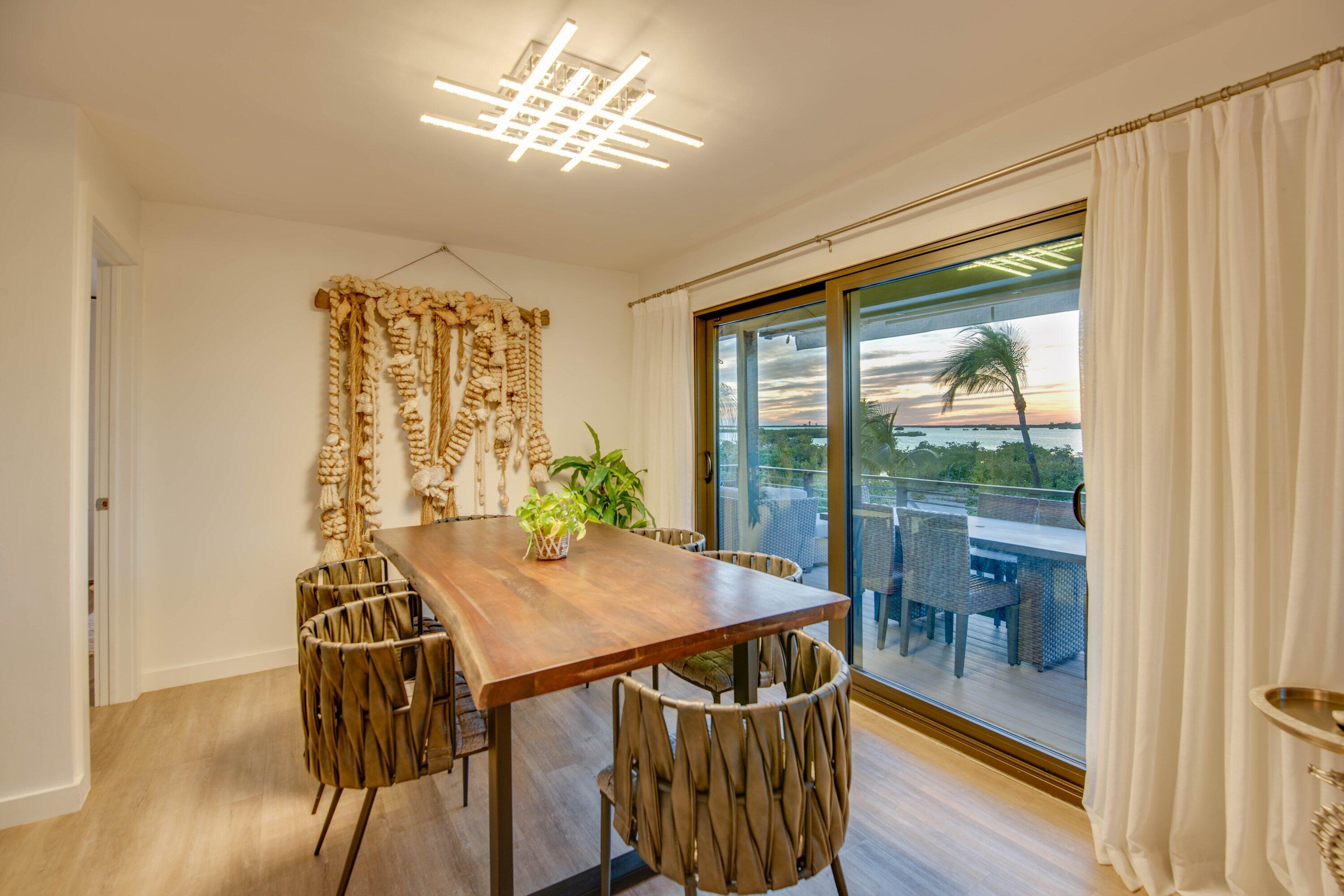 1422 Boca Chica Road Key West, FL 33040 - Photo 14 of 54 a view of a dining room with furniture window and outside view