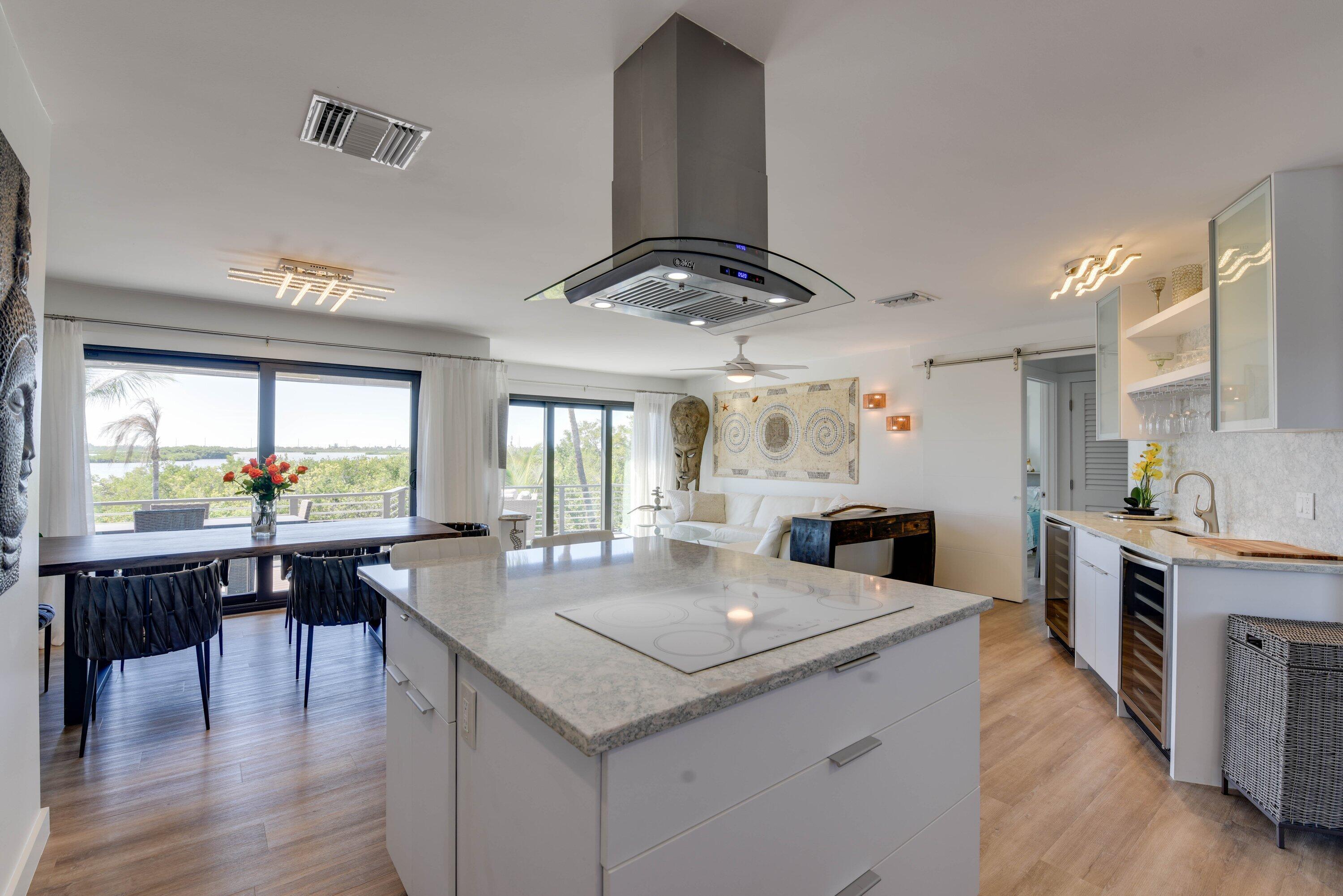 1422 Boca Chica Road Key West, FL 33040 - Photo 17 of 54 a kitchen with stainless steel appliances granite countertop a stove and a large window