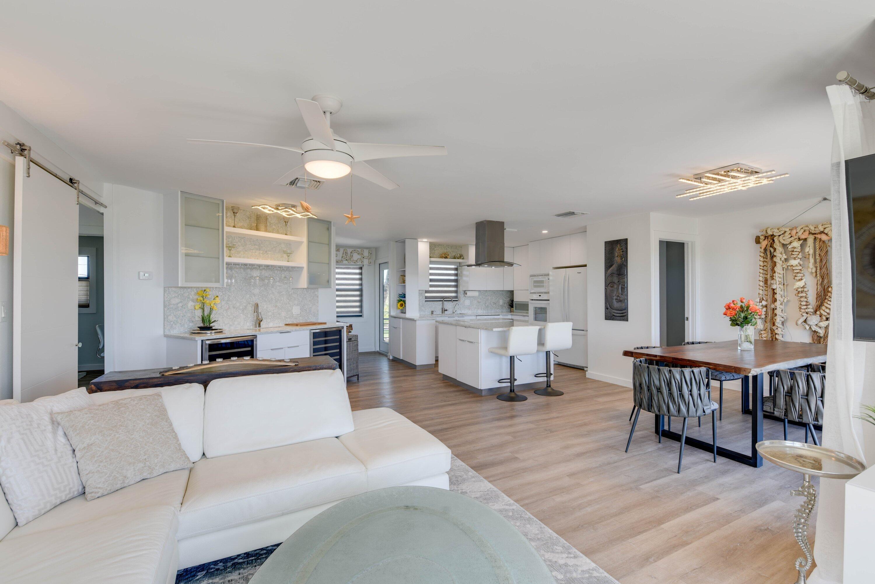 1422 Boca Chica Road Key West, FL 33040 - Photo 23 of 54 a living room with furniture and a dining table with kitchen view