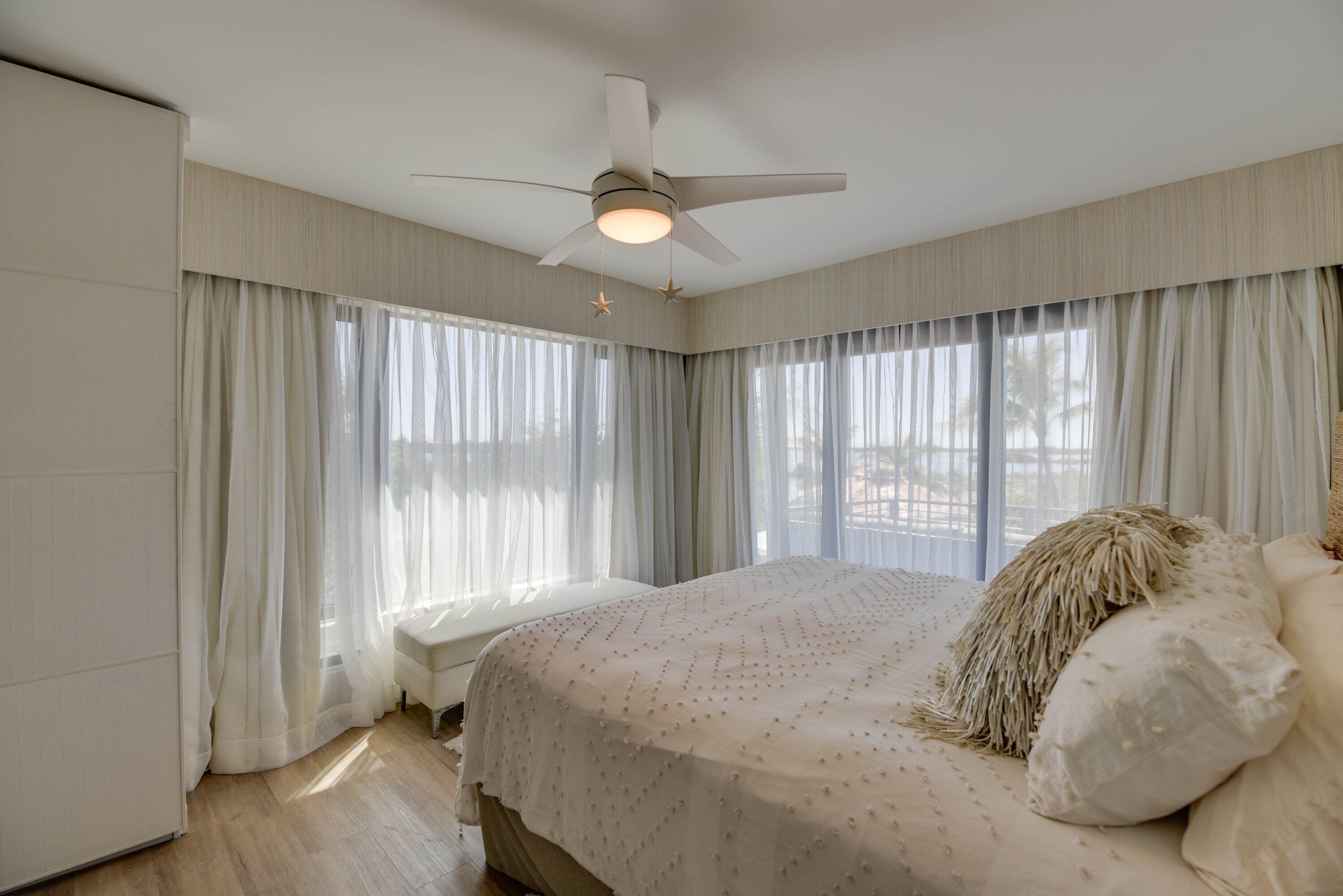 1422 Boca Chica Road Key West, FL 33040 - Photo 27 of 54 a spacious bedroom with a bed and a large window