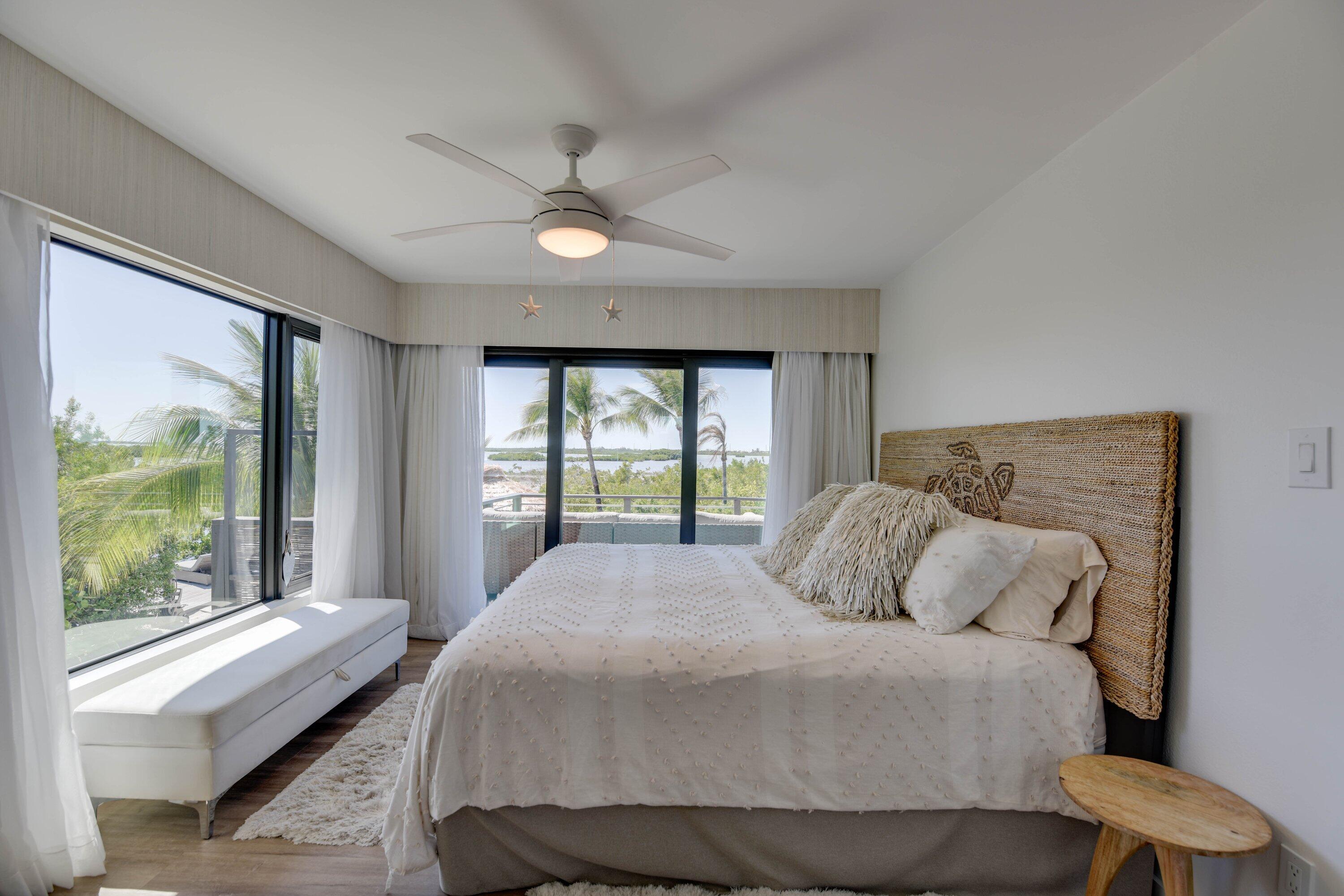 1422 Boca Chica Road Key West, FL 33040 - Photo 28 of 54 a bedroom with a large bed and a large window