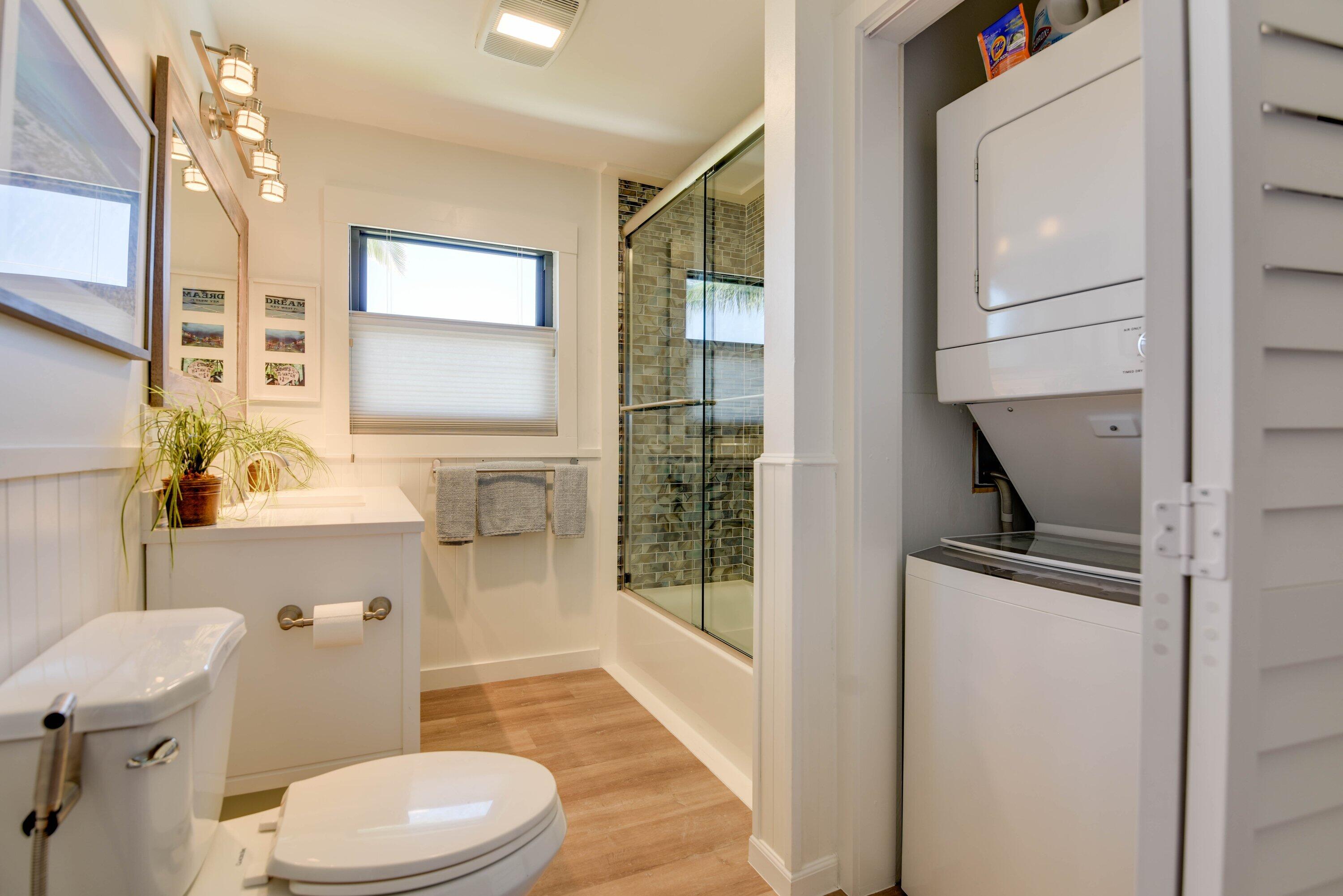1422 Boca Chica Road Key West, FL 33040 - Photo 39 of 54 a bathroom with a granite countertop toilet sink and mirror