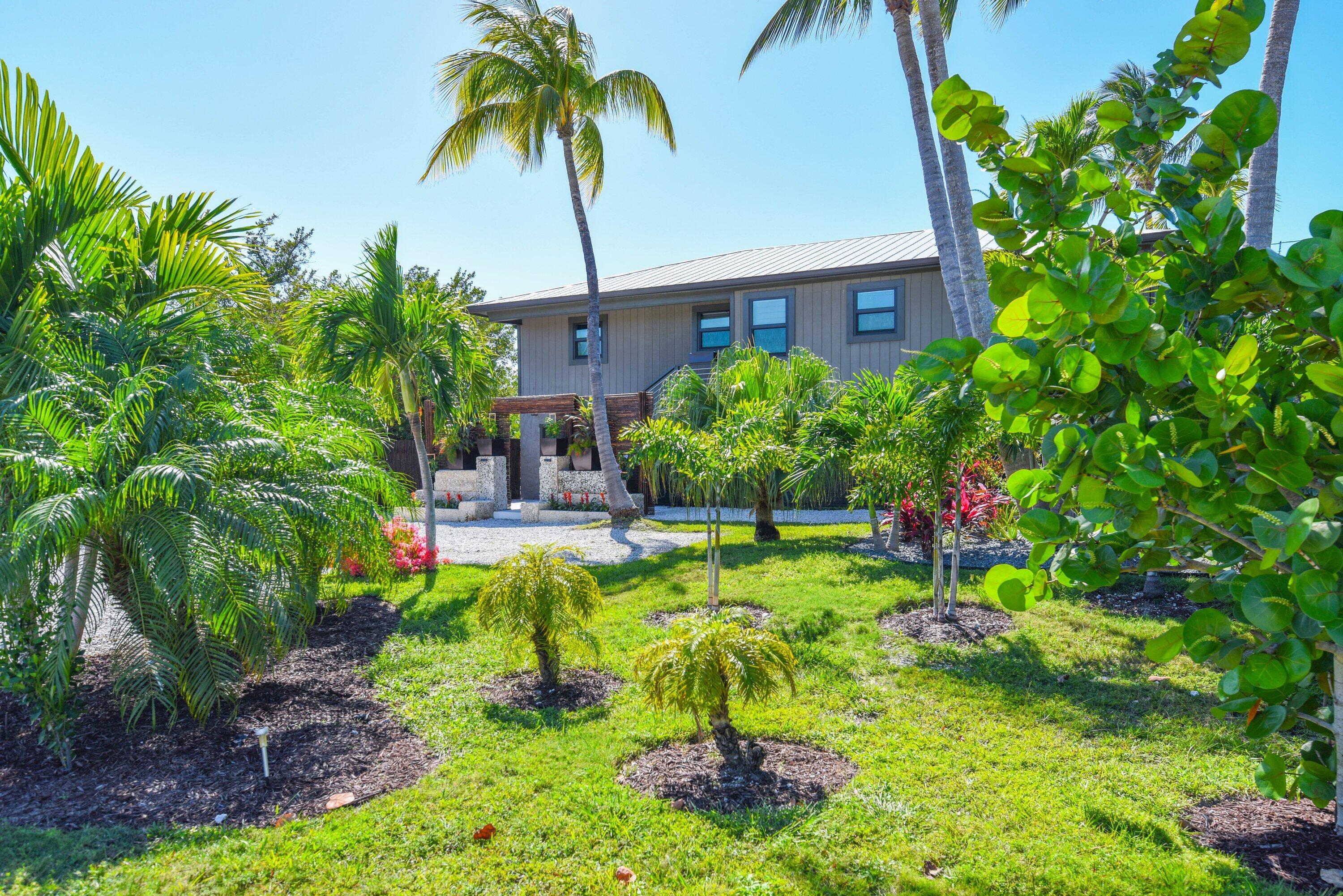 1422 Boca Chica Road Key West, FL 33040 - Photo 42 of 54 a front view of a house with a yard and swimming pool