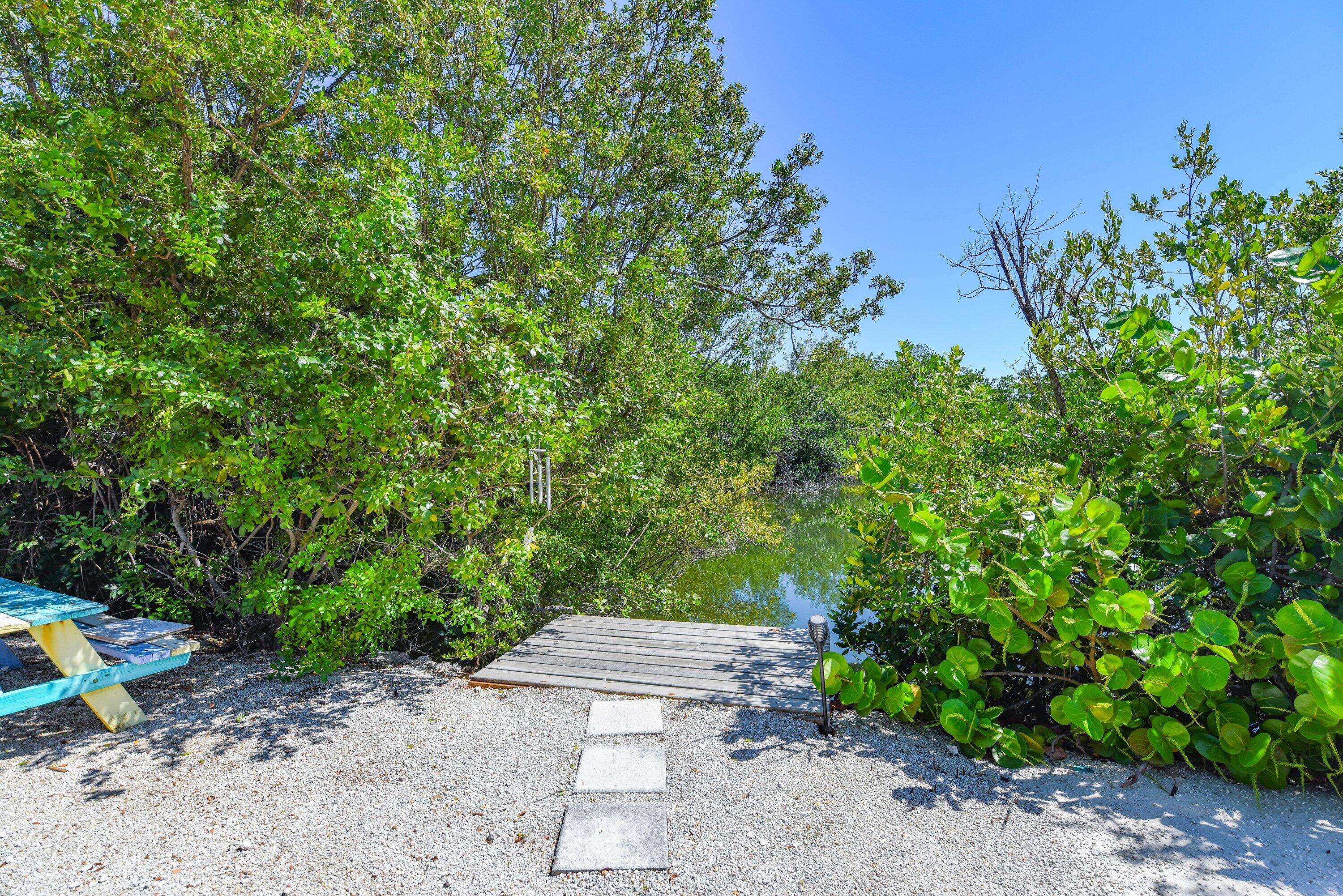 1422 Boca Chica Road Key West, FL 33040 - Photo 47 of 54 a view of a backyard with chair and potted plants