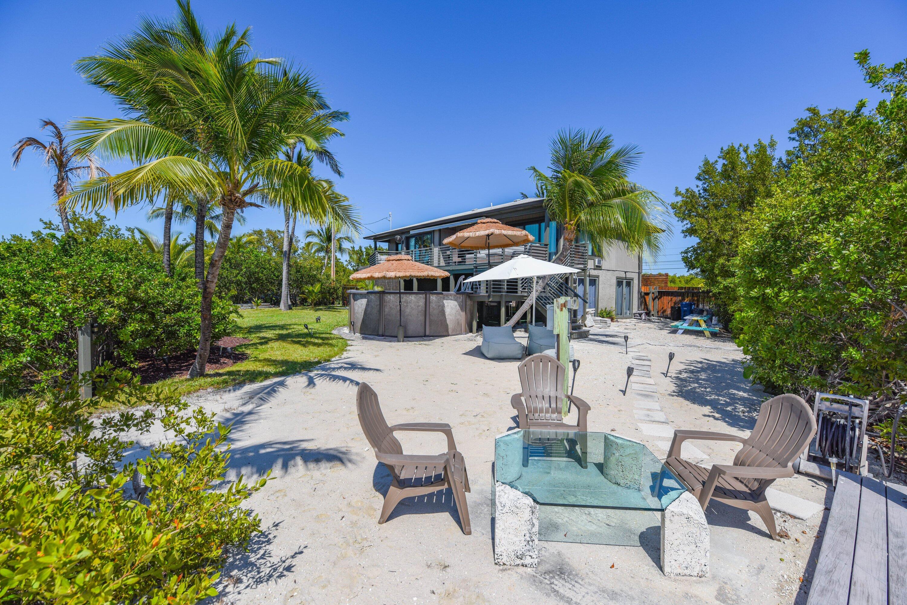1422 Boca Chica Road Key West, FL 33040 - Photo 50 of 54 a view of backyard with outdoor seating a patio and plants