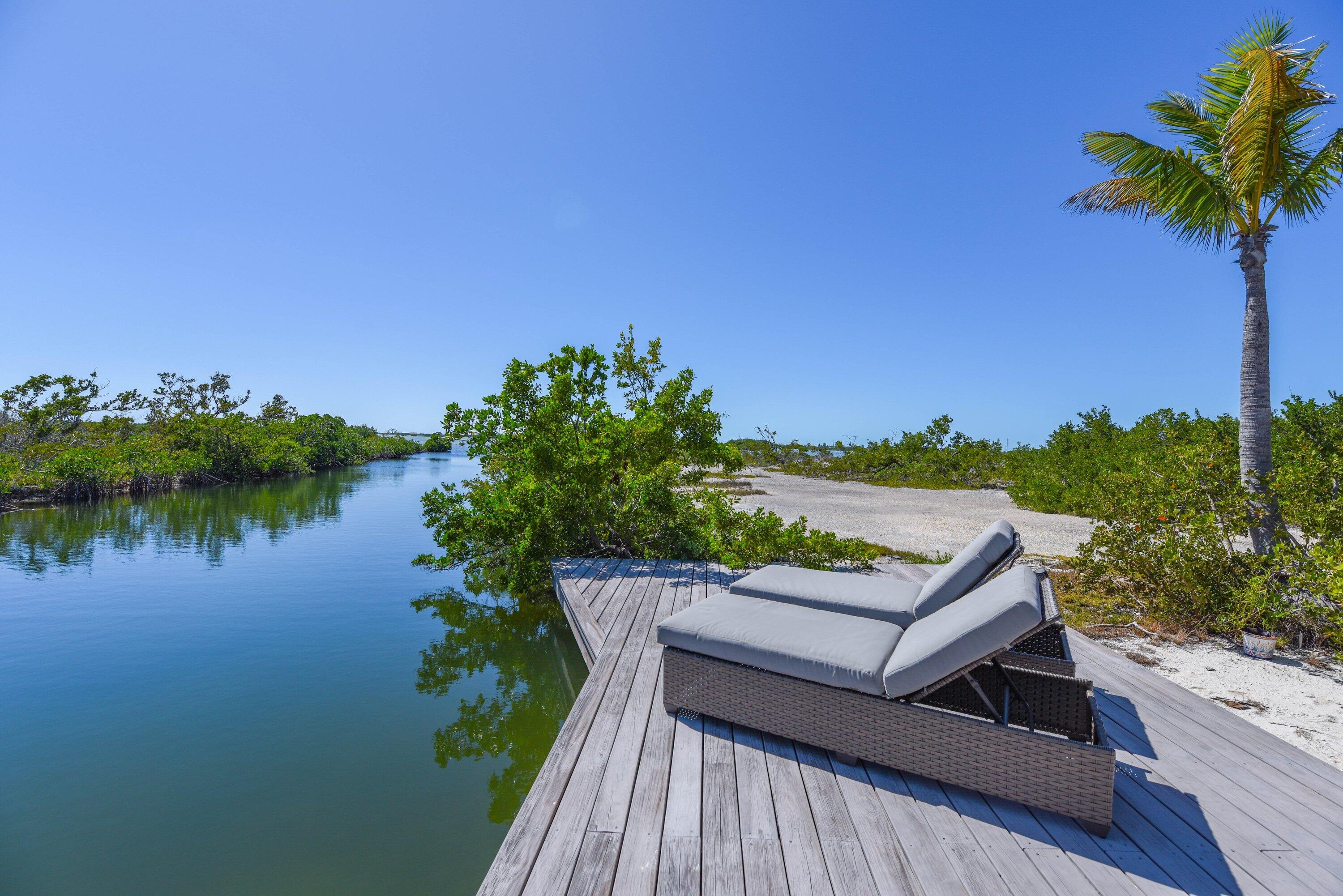 1422 Boca Chica Road Key West, FL 33040 - Photo 52 of 54 a view of a terrace with a garden and lake view